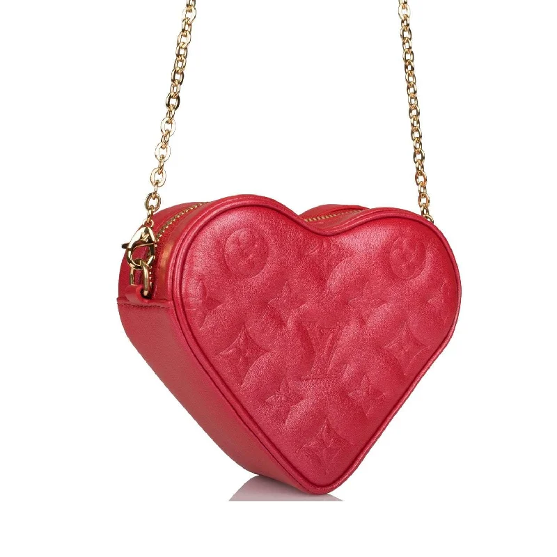 Ladies Louis Vuitton Petite Malle bags in a pastel color for a soft lookLouis Vuitton Red Lambskin Embossed Monogram Heart On Chain Crossbody