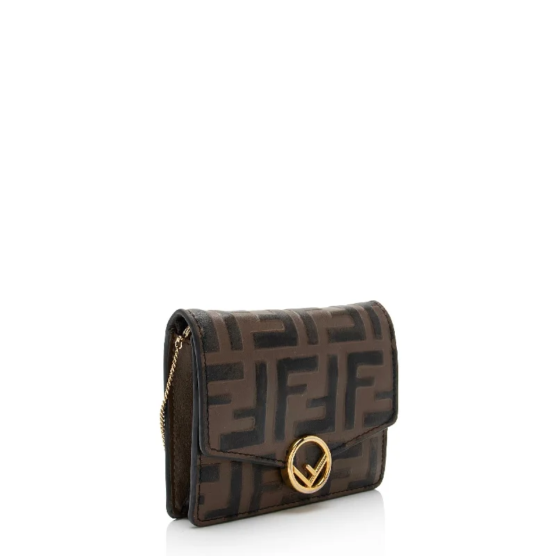 Fendi bags with a touch - screen - friendly pocket for using devices without taking them outFendi FF Embossed 1974 Mini Crossbody Bag (SHF-NZatLn)